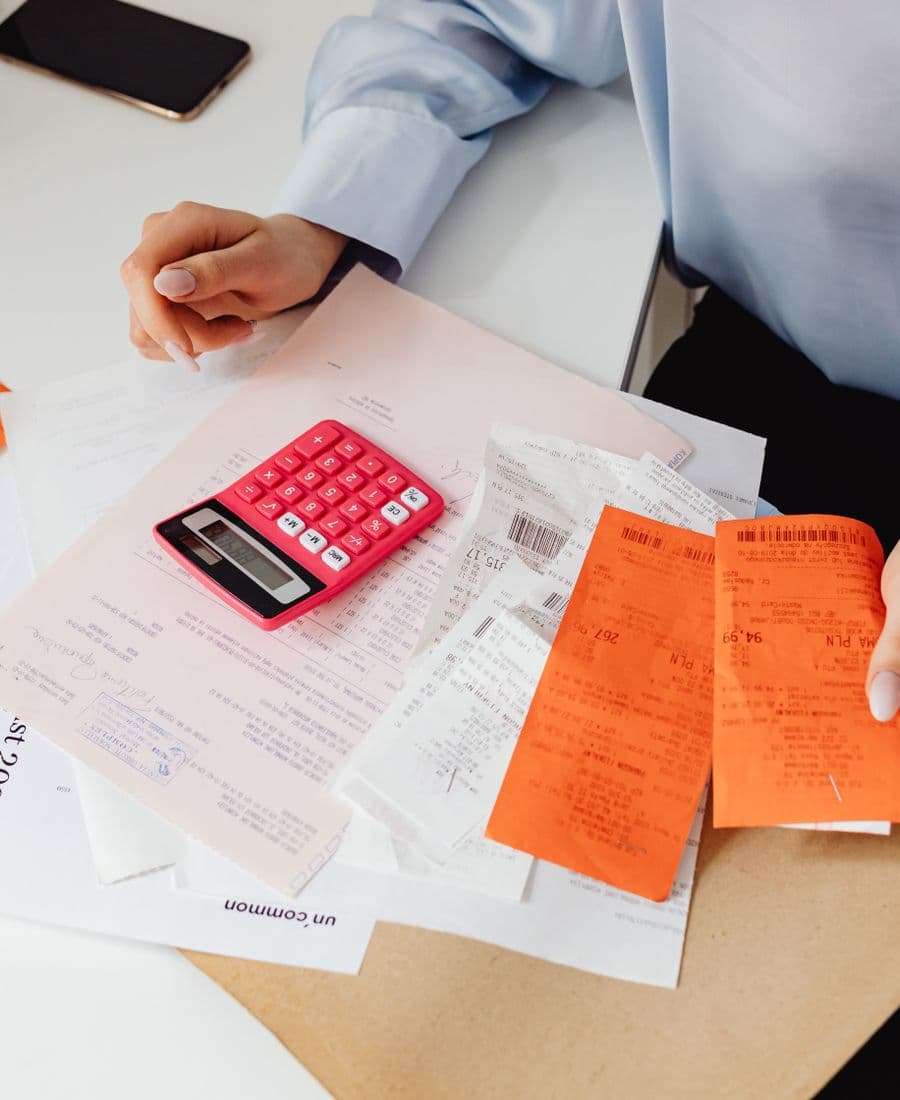 Medical billing professional reviewing paperwork at a desk